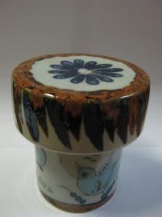 Ken Edwards Round Candle Holder (B4) with  green, two shades of blue and brown flowers, birds, and butterflies decorated on the side or inside on bowls or plates