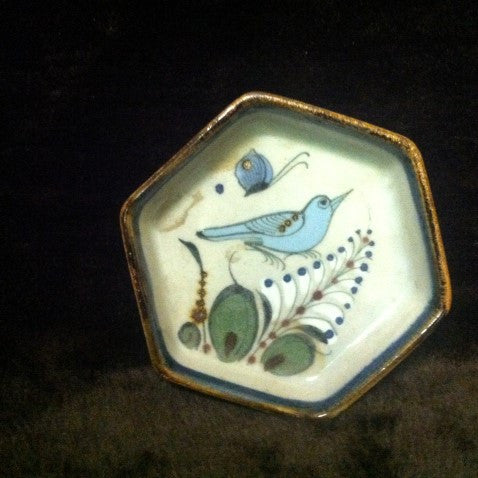 Ken Edwards Mini Hexagon Tray with brown rim and natural grey clay color background with blue and green bird, butterfly and plant life.
