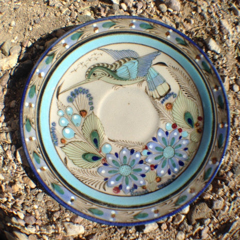 This Ken Edwards Collection Series saucer is compatible with the CV5 tea cup and sold separately. It is natural grey clay color background with birds, butterflies, and leaves in blue, green, black and brown on the outside.  