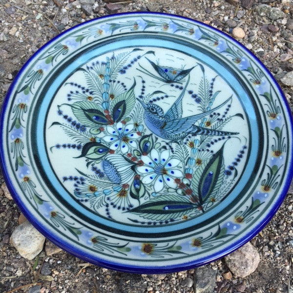  Blue rim Ken Edwards Collection series 8' salad plate .  It is natural grey clay color background with birds, butterflies, and leaves in blue, green, black and brown on the outside.