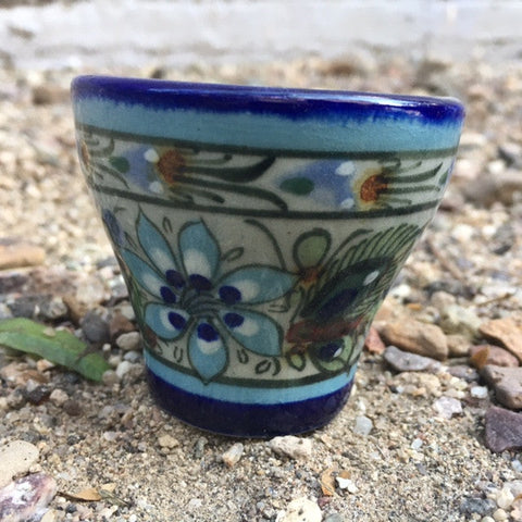 Ken Edwards Collection mini cup with  green, two shades of blue and brown flowers, birds, and butterflies decorated on the side or inside on bowls or plates