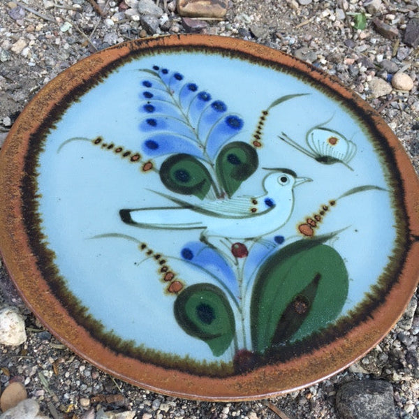 Ken Edwards Pottery round triviet with brown rim and blue and green flowers and bird.